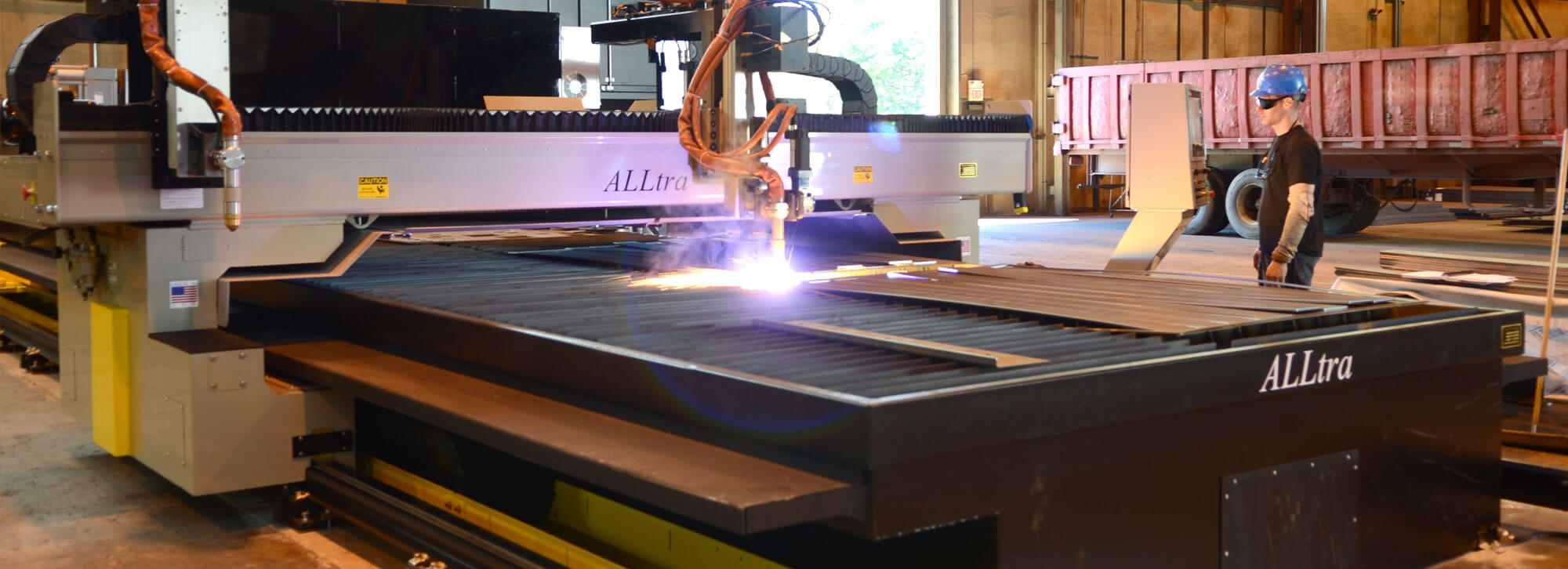 Fabricator at Millwood Metalworks using the ALLtra 400 Plasma and Flame cutter to form custom metal parts